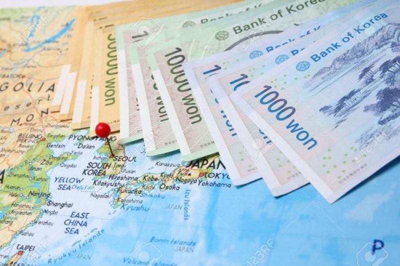 39026985-South-Korean-Won-currency-with-pin-on-Korea-on-map-Stock-Photo.jpg